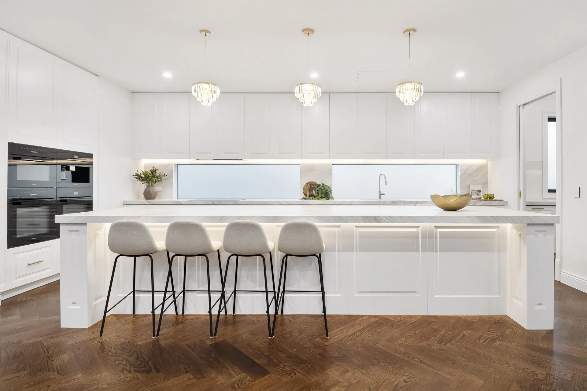 Kitchen with timber-look herringbone flooring from a TMBR supply and install project in Doncaster East