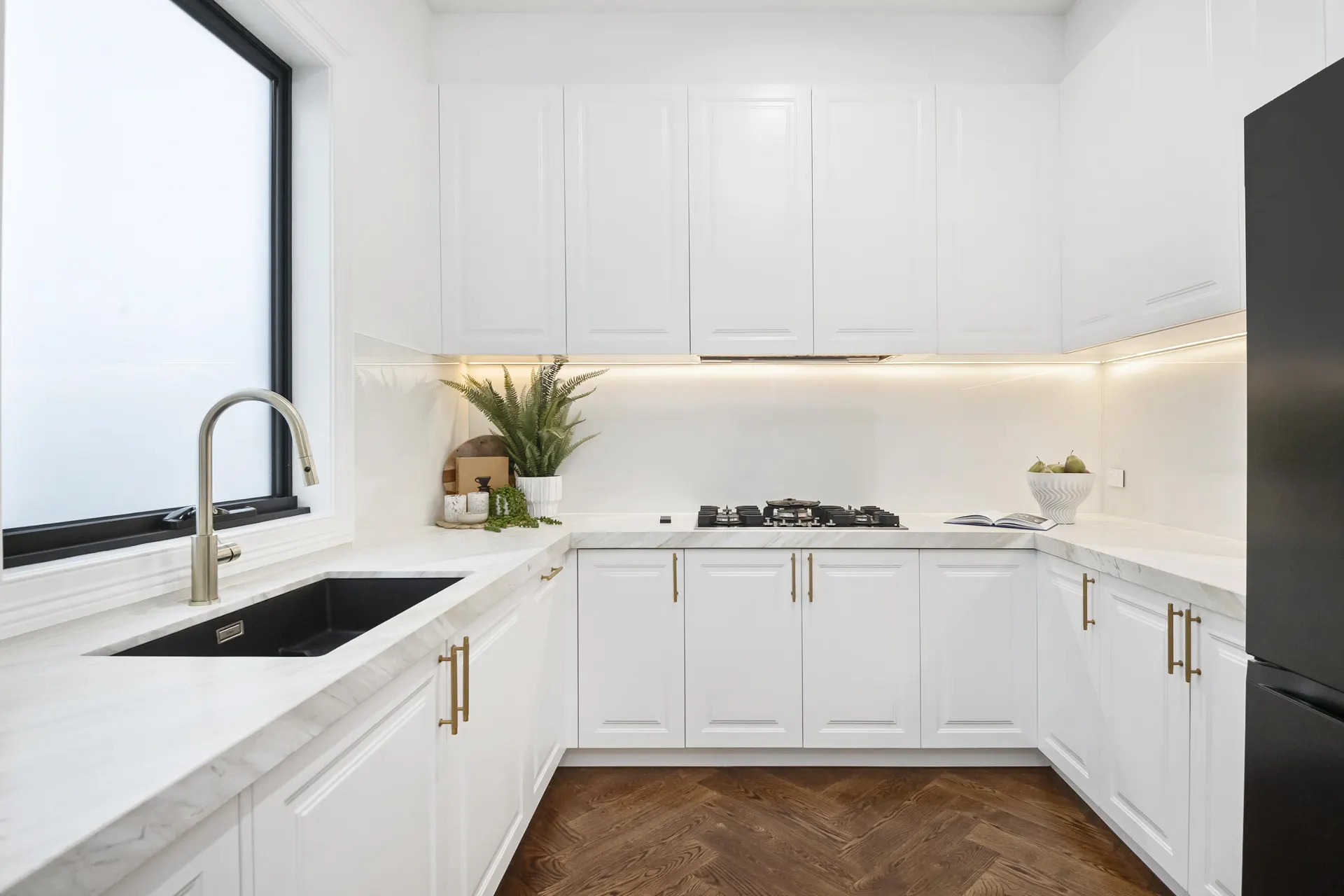 Kitchen with timber-look herringbone flooring from a TMBR supply and install project in Doncaster East