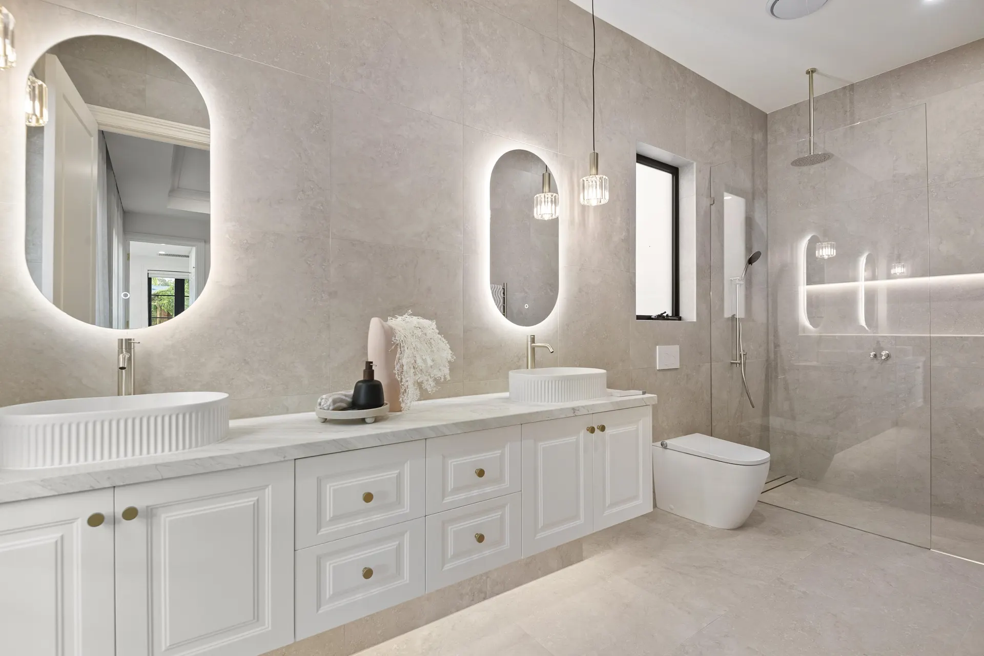 Ensuite with double vanity and stone-look tiles
